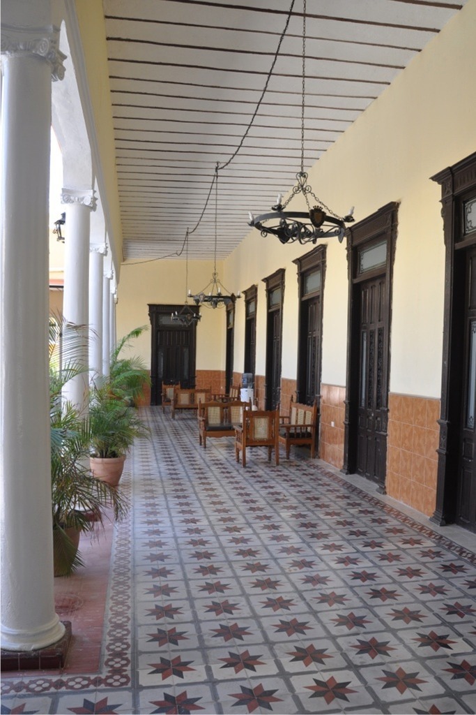 hotel hallway columns antique guest room doors